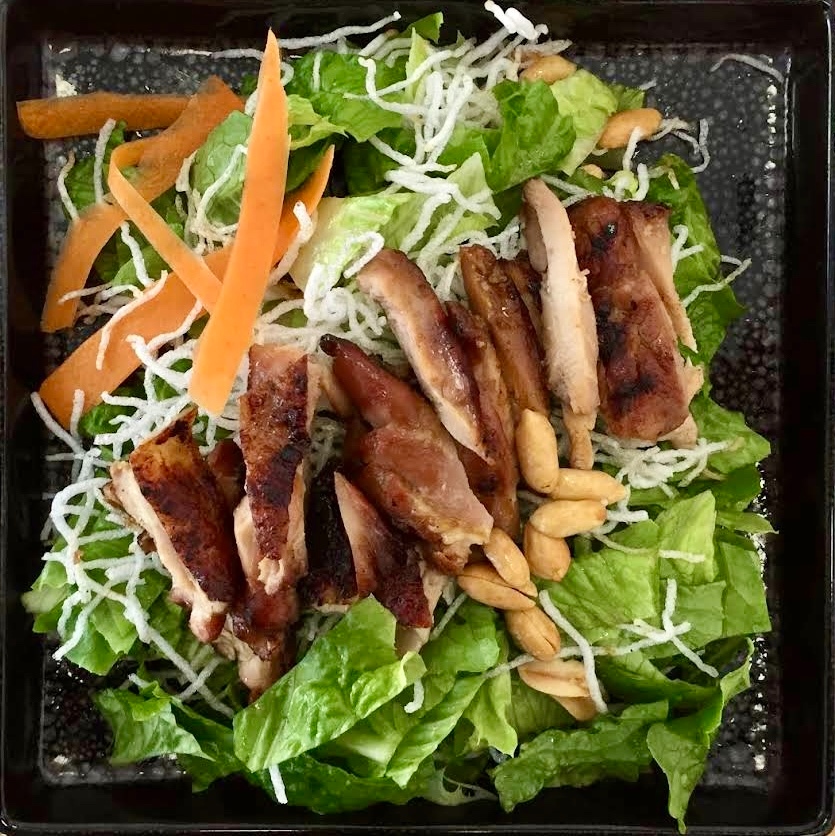 Chicken teriyaki salad with crispy noodles and peanuts